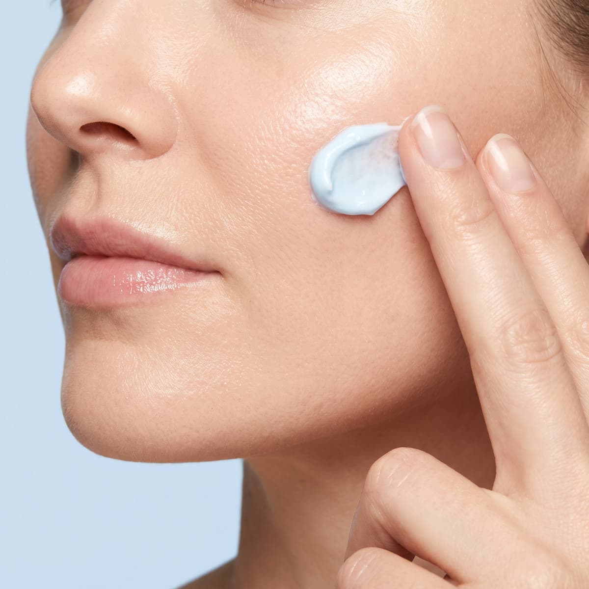 The blue cream pressed into a cheek